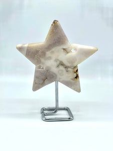 pink amethyst star on metal stand 